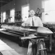 Robert Goddard with one of his later rockets in his workshop at Roswell, New Mexico, in October 1935 (NASA)